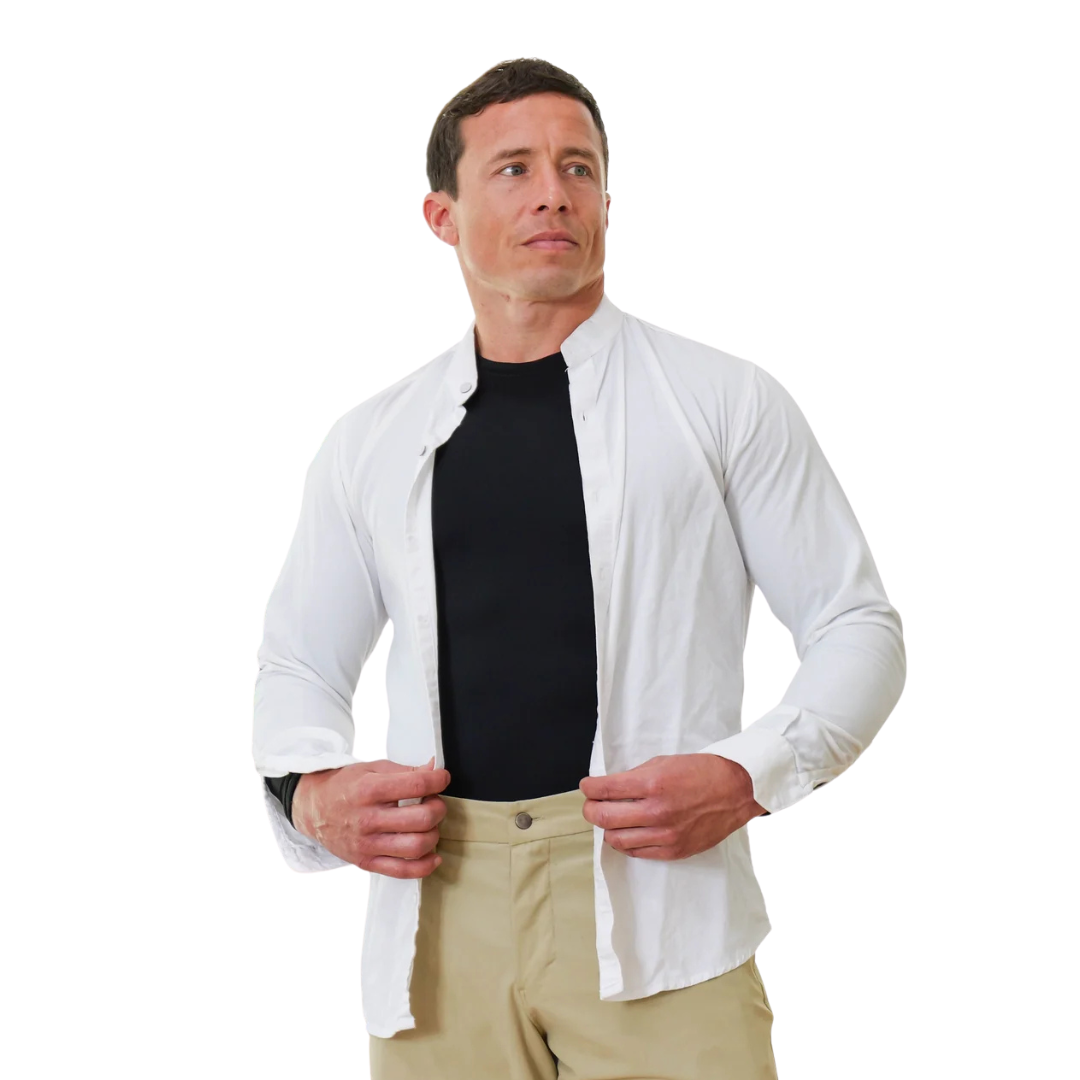 Man layering a black compression shirt under an open white button-down for a smooth fitted look, men’s compression shirt